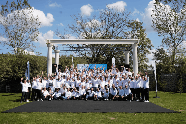 Netafim workers waving at a company event